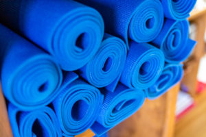 Yoga mats stacked at Full Circle Yoga in the heart of Kansas City.