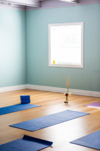 Full Circle Yoga studio in Midtown Kansas City set up with mats before class