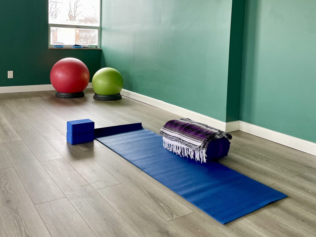 blue yoga mat and props at Full Circle Yoga KC's new studio at 7830 State Line Rd. Suite 100, Prairie Village, KS 66208